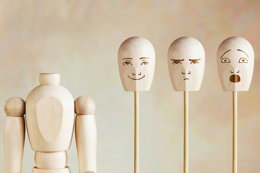 Various human emotions and mood. Abstract image with a wooden puppet